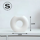 White Nordic style ceramic donut vase in a small size, featuring a modern circular design, ideal for office and living room decor.