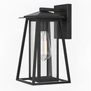 Outdoor wall lantern sconce with glass panels, featuring a black steel waterproof IP44 design, displayed on a table possibly inside a room, showcasing its rectangular shape and metal construction.