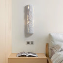 Outdoor wall light with IP65 waterproof rating, featuring a premium resin faux rock finish, displayed against a wooden background with hardwood flooring.