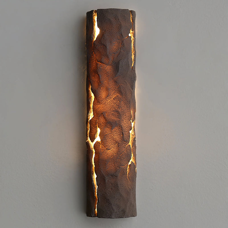 Outdoor wall light featuring IP65 waterproof rating with a premium resin faux rock finish in amber and gold tones, designed to resemble a rectangular shaped rock with wood and metal accents.