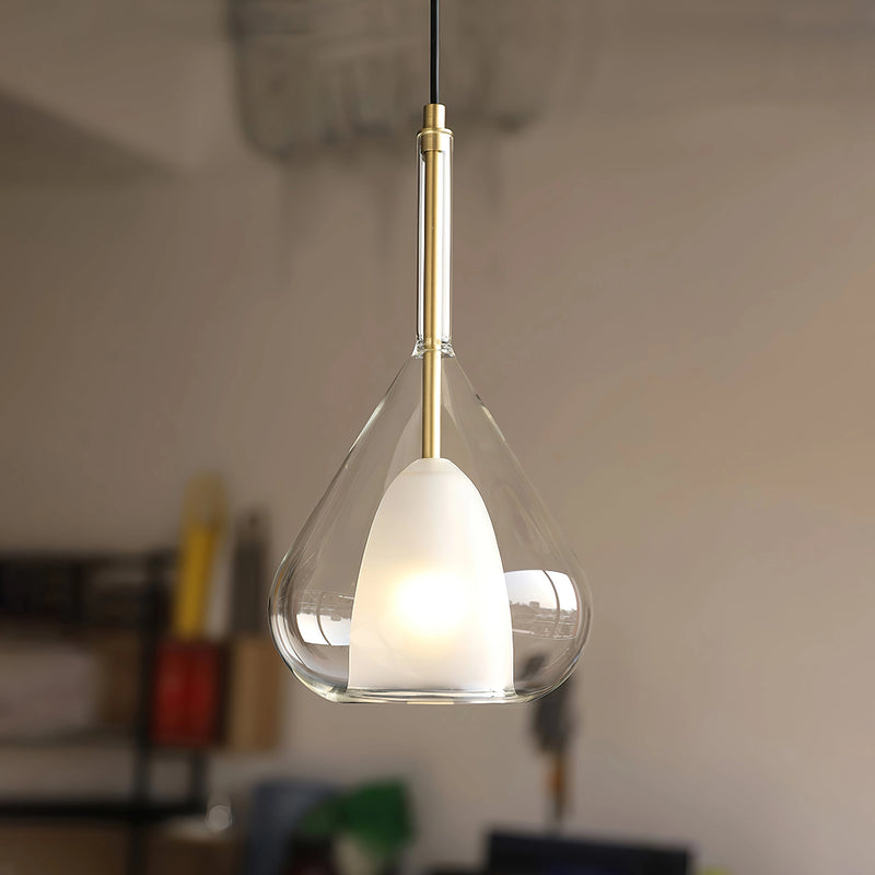 Clear raindrop-design pendant lamp with starlight effect, featuring a circular metal light fixture attached to a ceiling, in a Nordic style.