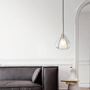 Nordic style pendant lamp featuring a clear raindrop design with starlight effect, displayed over a grey couch in a room with hardwood flooring.