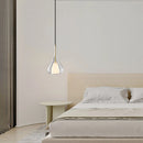 Nordic style pendant lamp featuring a clear raindrop design with a starlight effect, hanging in a cozy interior with wooden furniture and grey shades.