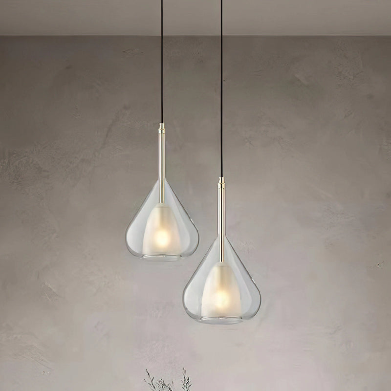 Clear glass pendant lamp featuring a raindrop design with a starlight effect, suspended from a wooden ceiling fixture, showcasing a circular metal and glass structure with an illuminated light bulb.