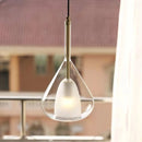 Nordic style pendant lamp featuring a clear glass raindrop design with starlight effect, displaying a metal frame and wooden accents, suspended from a ceiling.