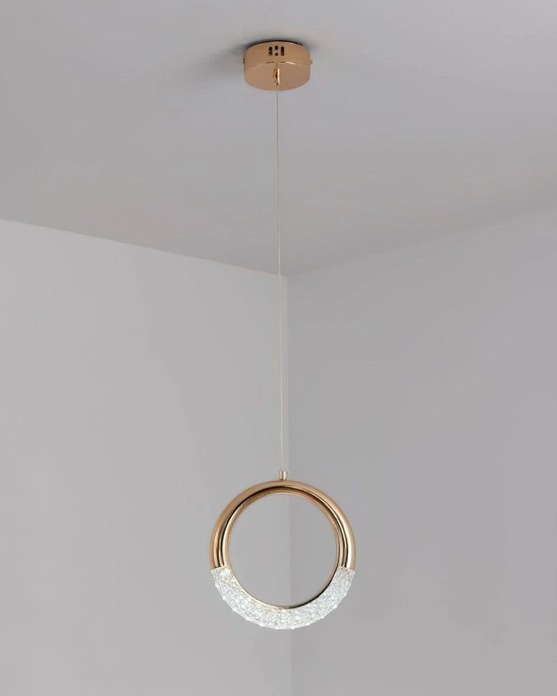 Modern Pendant Lamp Dante chandelier featuring a combination of wood and metal, with circular and rectangular elements, designed to resemble body jewelry, hanging from the ceiling.