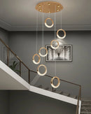 Modern Dante pendant lamp featuring a rectangular wooden design, with artistic shelving on a wall, enhancing the interior lighting.