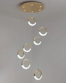 Modern Dante Pendant Lamp chandelier featuring a circle-shaped ceiling fixture made of metal, designed to resemble water or liquid with a play of tints and shades.