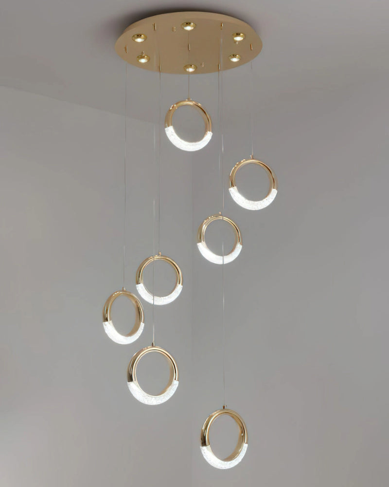 Modern Dante Pendant Lamp chandelier featuring a circle-shaped ceiling fixture made of metal, designed to resemble water or liquid with a play of tints and shades.