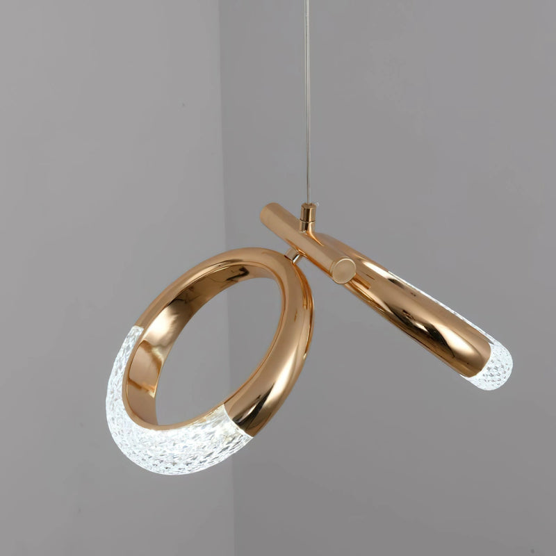 Modern Pendant Lamp Dante featuring a chandelier design with gold and silver elements, oval and circular shapes, combined with wooden accents in a rectangular form.