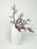 Decorative resin bowl designed with nature-inspired elements like twigs, plants, and tree motifs, artistically arranged on a table as a creative ornament.