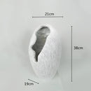 Decorative bowl inspired by nature, crafted from resin, featuring a monochrome design with elements resembling rocks, plants, and artistic drawings.