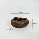 Decorative resin bowl inspired by nature, featuring intricate tree and plant illustrations with artistic detail on a themed background.