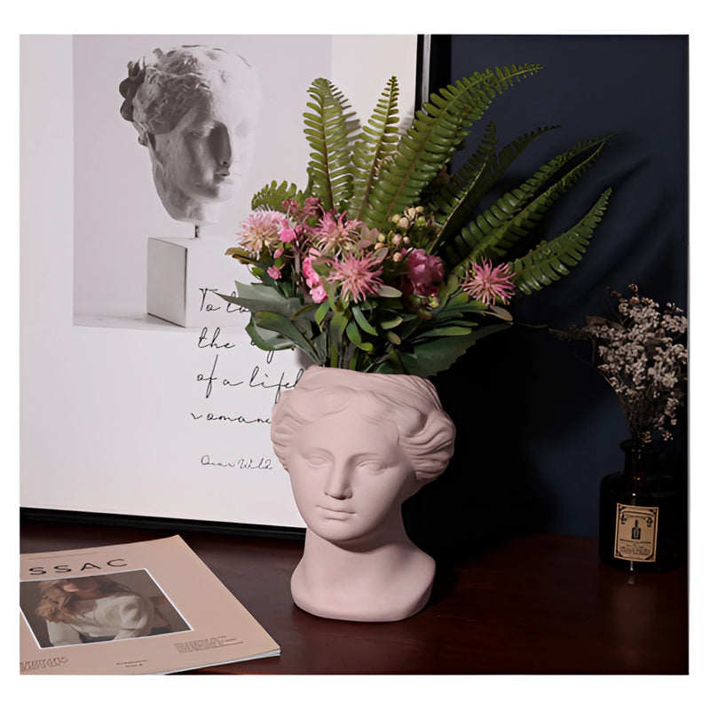 Resin Neoclassical Venus Vase in blush pink, teal, and grey options, featuring an artistic design with flowers and houseplants arranged inside, enhancing home interior décor.