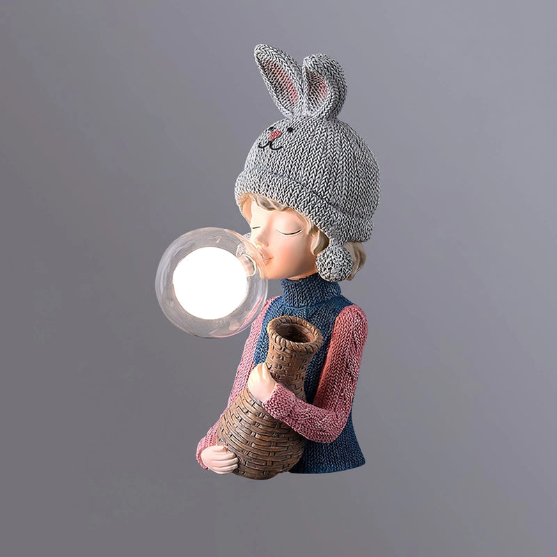 Resin table lamp featuring an elegant rabbit girl design with a dual glass lampshade, detailed costume hat, and artistic patterns on a wooden base, in grey, dimensions Ø 3.1″ x W 5.1″ x H 12.2″.