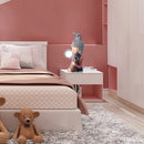 Resin table lamp designed as an elegant rabbit girl, featuring dual glass lampshades, placed in a room with grey and orange interior design elements including furniture and textiles.