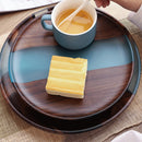 Handcrafted epoxy resin wood tray showcasing an assortment of cheeses and ingredients, ideal for serving.