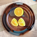 Handcrafted epoxy resin wood tray filled with various citrus fruits including Valencia oranges, clementines, and bitter oranges, displayed on a table.