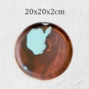 Handcrafted epoxy resin plate, Teller variant, measuring 20cm by 2cm, featuring a circular hardwood design with a rich brown wood stain and varnish finish, styled as both dishware and art.