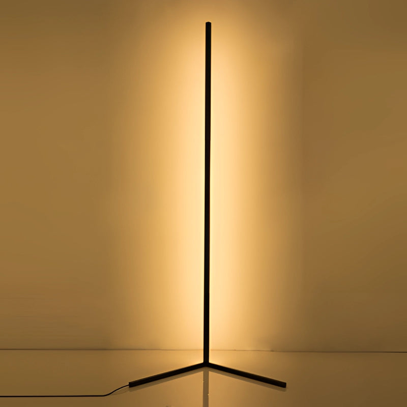 RGB corner floor lamp with LED lights, featuring a remote control, illuminating a room with amber and gold tints.