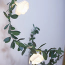 Battery-operated LED garland featuring rose flowers with petals and branches, designed as a decorative houseplant.