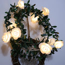 Battery-operated LED garland featuring rose flowers arranged on branches, ideal for decorative flower arranging.