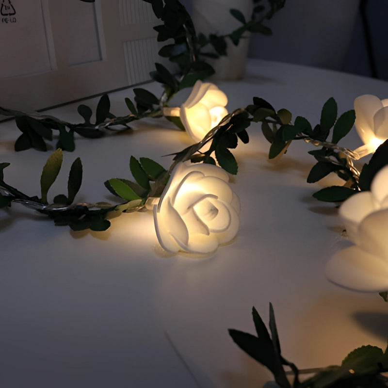 Battery-operated LED garland featuring 40 rose flower string lights on a 20-foot branch, decorated with floral designs and tints and shades, ideal for events and ceiling ornamentation.