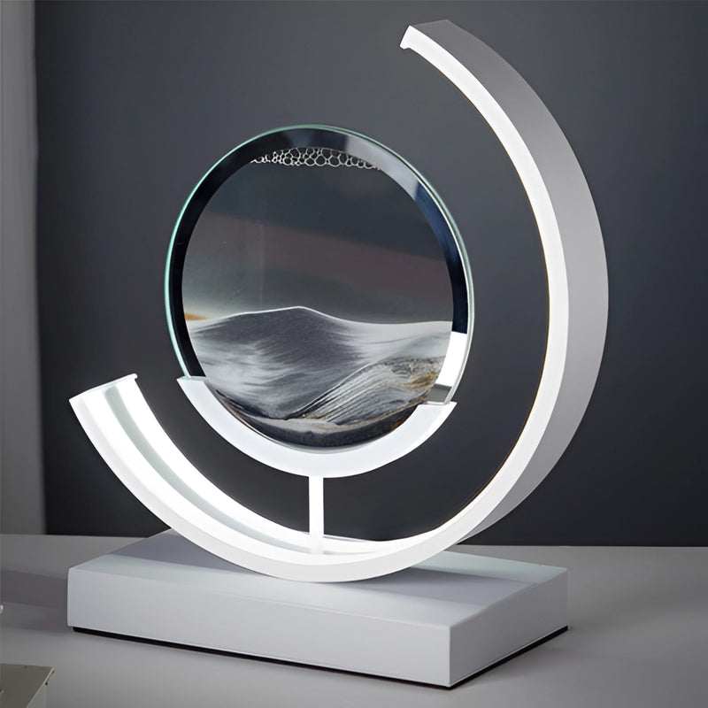 LED table lamp featuring a dynamic 3D sand art painting, with circular and automotive-inspired design elements illuminated by ambient light.