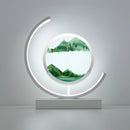 Dynamic 3D sand painting light featuring a green and white Sand Art LED table lamp with artistic emblem and circular design elements.