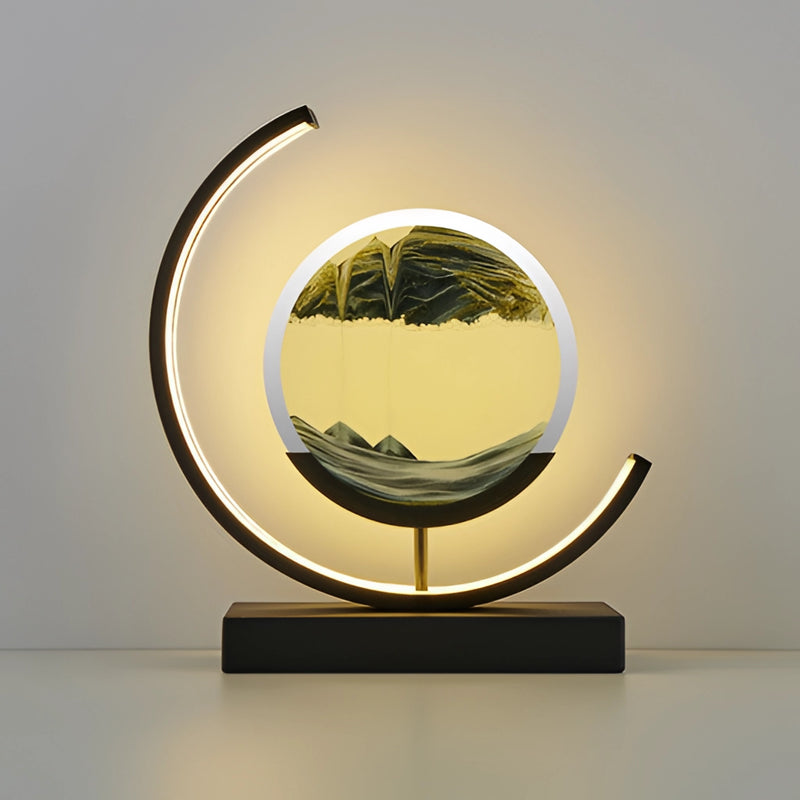 Black Sand Art LED Table Lamp featuring a dynamic 3D sand painting light, displayed in a rectangular frame with artistic and architectural elements reflected in its design.