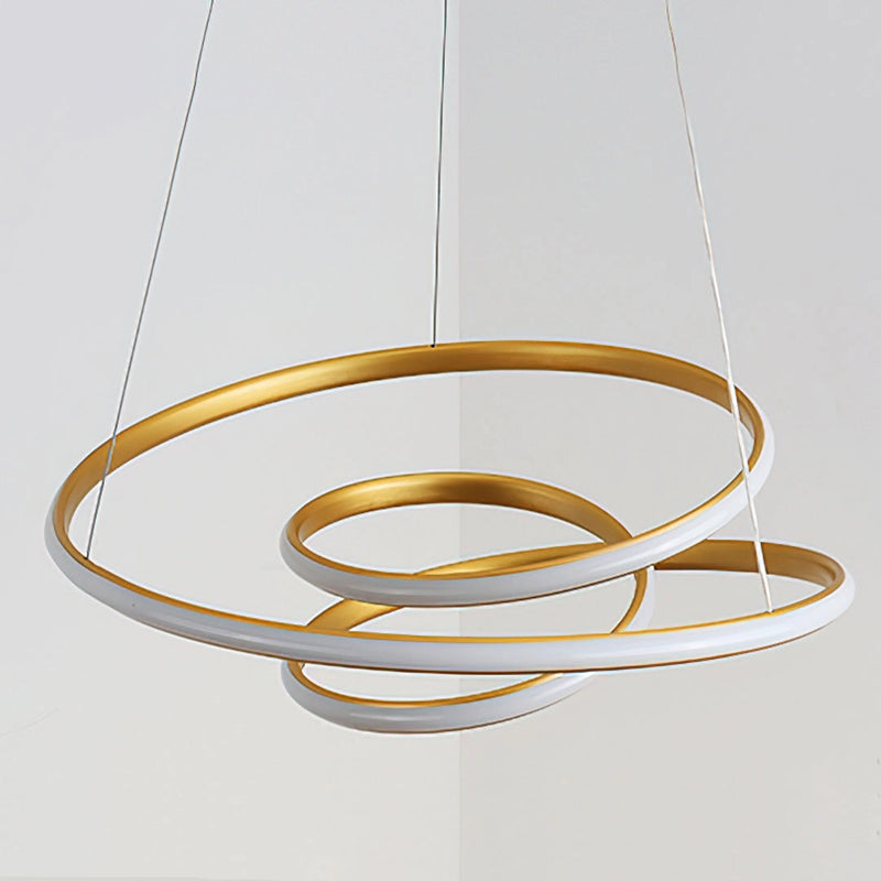 Elegant spiral pendant light featuring a modern design with warm illumination, crafted from gold-colored aluminum in an oval shape with artistic and fashionable metallic accents.