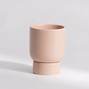 Small misty rose ceramic vase designed for gardening or bonsai, displayed on a wooden table.