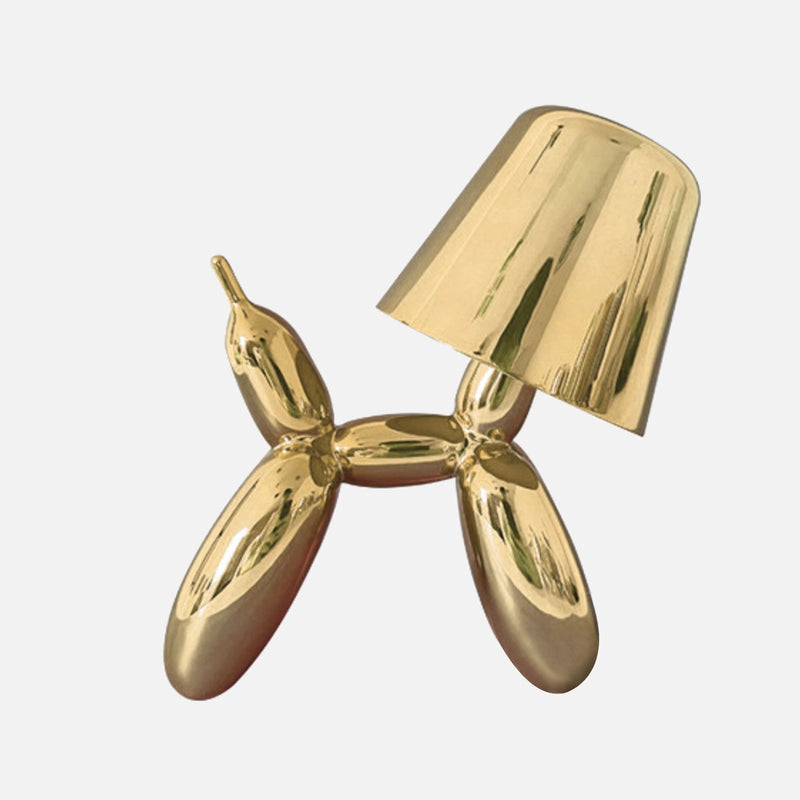 Gold table lamp featuring a touch-sensitive, dimmable crystal with a balloon dog design, adorned with jewelry-like elements.