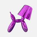 Violet table lamp featuring a crystal touch-sensitive, dimmable design with a balloon dog shape, highlighted by purple and magenta tones.