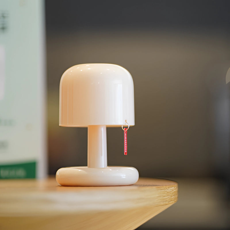 Dimmable ivory table lamp with a touch switch, featuring a glossy finish on a hardwood base, equipped with lighting accessories.
