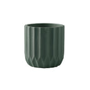 Large jade-colored textured ceramic polygon vase with a geometric design displayed on a wooden surface.
