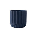 Large navy textured ceramic polygon vase with a geometric design, displayed as tableware.