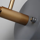 Elegant retro-style wall light with a matte finish, featuring metallic elements resembling pipes and clock components, possibly mistaken for silver, steel, or titanium.