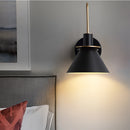 Elegant retro design wall light with a matt finish, featuring a rectangular lamp mounted on a wooden base, complemented by interior design elements including pillows and ceiling accents.