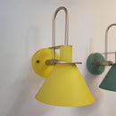 Elegant retro design wall light with a matt yellow finish, featuring a circular lamp set within a rectangular metal and wood ceiling fixture.