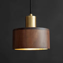Walnut wood pendant lamp inspired by Japanese woodworking, featuring a cylindrical shape with metal accents and a circular lampshade.