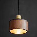 Walnut wood pendant lamp inspired by Japanese woodworking, featuring a rectangular lampshade, hanging from a ceiling fixture with metal accents.