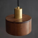 Ceiling pendant lamp crafted from walnut wood with cylindrical design, inspired by Japanese woodworking, featuring metal and glass elements.