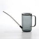 Gray watering can with an extended spout for accurate water delivery on a surface.