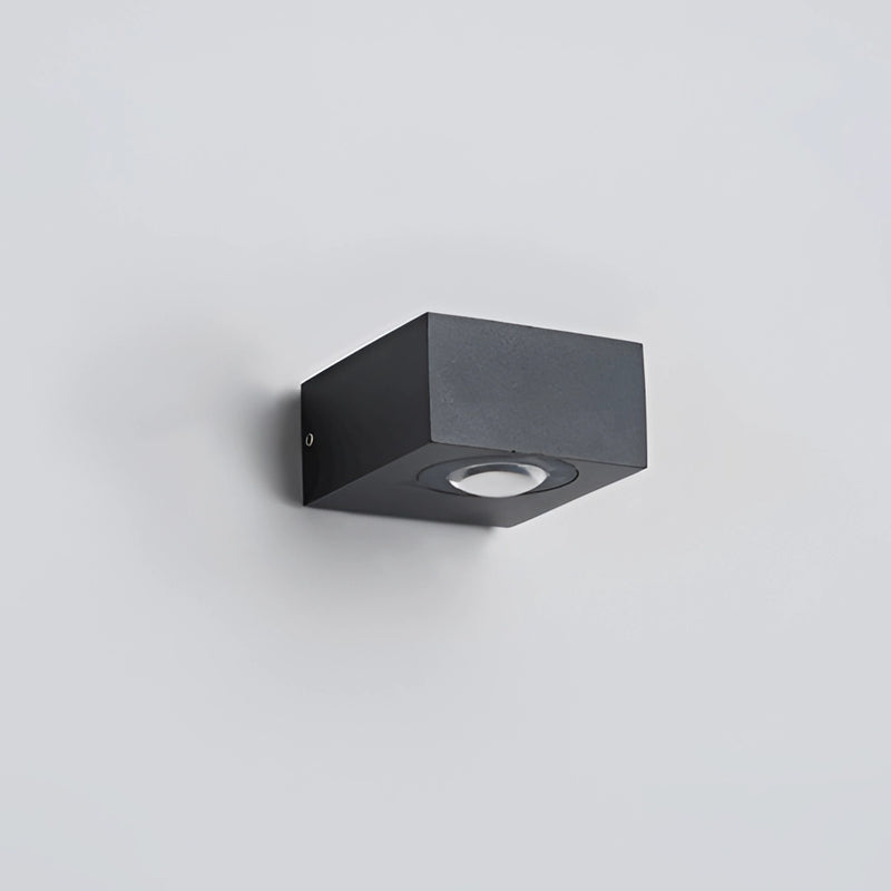 Black UFO-shaped waterproof wall light made of metal and aluminum, mounted on a ceiling.