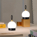 Cordless nightstand table light featuring a waterproof LED lamp blimp with quick charging, displayed on a wooden surface.