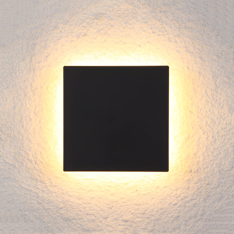 Brown and amber rectangular LED outdoor wall lamp made of aluminum, featuring a symmetrical design against a dark, calm sky.
