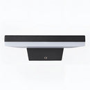 Waterproof LED outdoor wall lamp made of aluminum, displayed on an outdoor table.