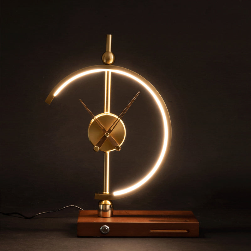 Wireless charging clock lamp featuring a wooden base with an integrated LED light and clock, metal accents, and a circular design, set in a dimly lit environment.