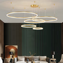 Circular LED Pendant Light with Gold Finish and Adjustable Height, featuring five dimmable rings in varying sizes (40cm, 60cm, 80cm), elegantly illuminating a modern interior space.